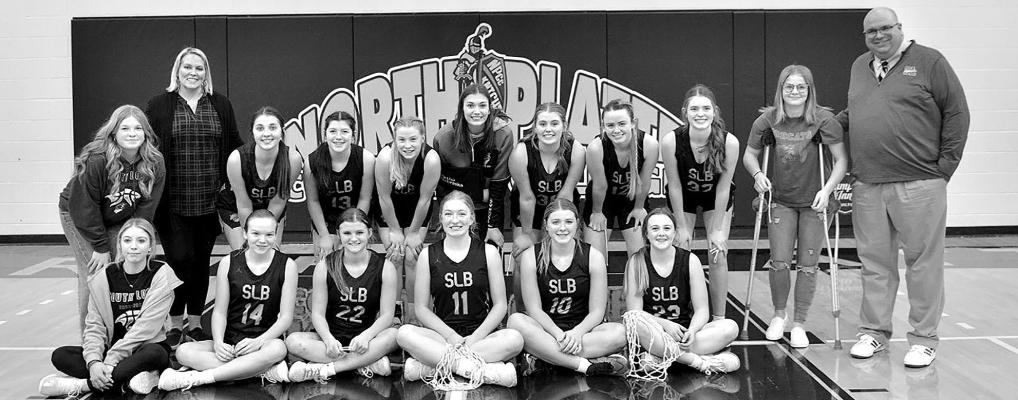 Members of the South Loup girls basketball team are, front row, from left: Erin Fitzgerald, Hayley Recoy, Ava Pandorf, Abby Stallbaumer, Taylor Ross, Lauryn Johnson; Back row: Neltje Reiff, Assistance Coach - Brook Moore, Jazlynn Bechtold, Greeley Hrupek, Jozi Reiff, Deylanie Rodgers, Maggie Birkel, Bryn Schwarz, Aubire Birkel, Angel Johnson, Coach Bryon Hanson (Courier photo by Patti Schwarz)
