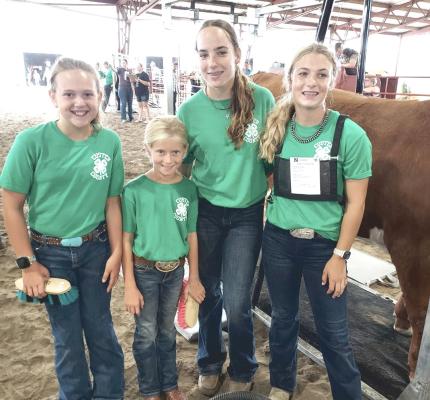 Members of one of the 4-H club's fitting teams posed for a photo during the 2023 Custer County Fair. From left are Bree Blowers, Kirby Viter, Kaygen Witthuhn, and Addison Stump.
