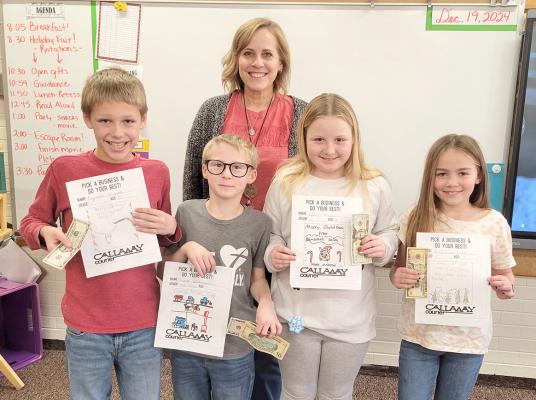 Callaway's 4th grade class drew business greeting card ads for the Courier and received a prize for their efforts. From left are Pryce Warren, awarded $5; Emmit Quitmeyer, 2nd place $15; Piper Hoesel, 1st place $20; and Raelyn Williams, 3rd place $10. Also pictured is teacher Nichole Rush. Not pictured is Noah Walker-Lopez, who was also awarded $5. (Courier photo by Ellen Mortensen)
