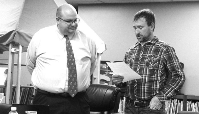 Callaway Superintendent Bryon Hanson, left, presided over the swearing in of new school board member Vincent Guthrie to open the school board meeting on Jan. 10. (Courier photo by Ellen Mortensen)