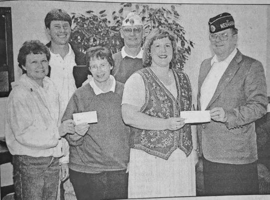 The Callaway Chamber donated $400 while the Bryson-Booker Post No. 59 American Legion and Legion Auxiliary each donated $50 for bookshelves at the Nigel Sprouse Memorial Library. Pictured front row, from left: Mary Ann Boldt of the Auxiliary, Librarian Bev Stivers, library board president DeeDee Morrow, and Bob Gavin of the Legion; back row: Chamber representative Rod Brestel and Legion Commander Doug Boldt. * This photo appeared in the May 10, 2001, issue of the Callaway Courier.