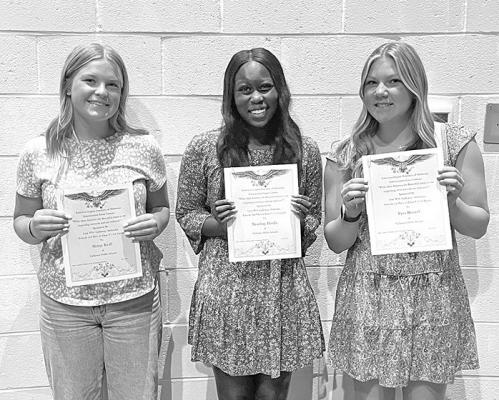 11th grade winners of the Americanism contest were, from left, Neltje Reiff, Nyachay Haidle, and Tyra Brestel.
