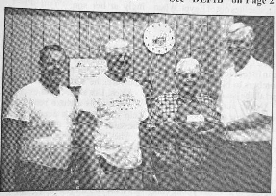 James Anderson (right) of the Central Nebraska Public Access Defibrillator Coalition presents one of four units to Callaway Senior Center representative Bernard Phifer. Also pictured are, from left, Roy Callahan, and Charlie Jorgenson representing Callaway Volunteer &amp; Rescue Fire Department, which also received units.