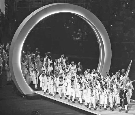 Team USA enters the arena during the parade of nations at the opening ceremony of the 2026 Winter Olympic Games. (Piero CRUCIATTI / AFP via Getty)