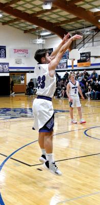 Freshman Dylan Pandorf goes in for the layup as a Rebel defender tries to swat it away. (Courier photos by Loleta Connell) Senior Silas Cool is open for an outside shot against ALC.