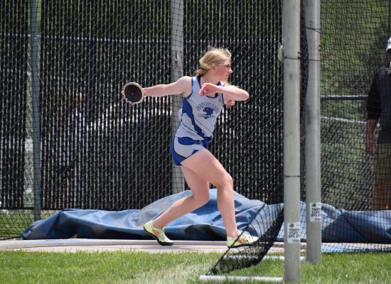 Abby Stallbaumer winds up to throw during discus action in Omaha. (Courier photo by Loleta Connell)