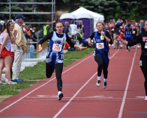 Halie Recoy crosses the line at the end of the 4 x 100 meter relay. (Courier photo by Loleta Connell)