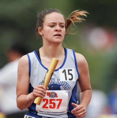 Heidi Donnegan churns through her leg of the 4 x 800 meter relay at the state track meet on May 18. (Courier photo by Corbey Dorsey)