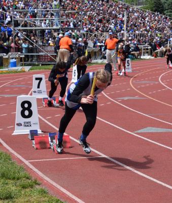 Joslyn Reiff starts off the girls 4x100 meter relay at the Class C NSAA State Track & Field Championships. (Courier photo by Loleta Connell)