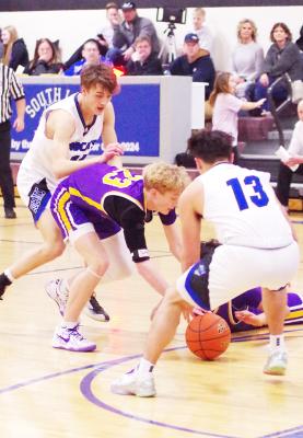 Conner Paulsen fights for the ball against S-E-M. (Courier photo by Ronda McFate)