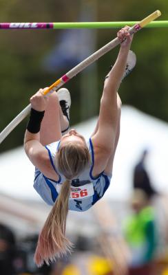 Reagan Cool kicks up hard during pole vault action at the NSAA State Track & Field Championships in Omaha. (Courier photo by Corbey Dorsey)
