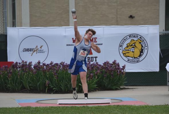 Rio Remund gives the shot put a mighty heave. (Courier photo by Loleta Connell)