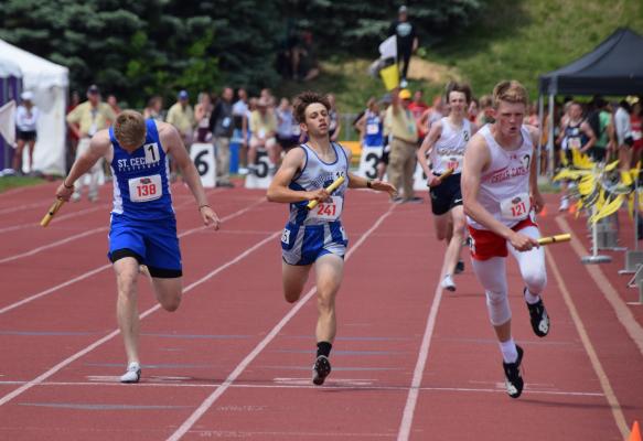 Silas Cool hits the line in a photo finish of the 4 x 800 meter relay. The South Loup boys came into the event ranked 16th in the field and took second place in Class C. (Courier photo by Loleta Connell)