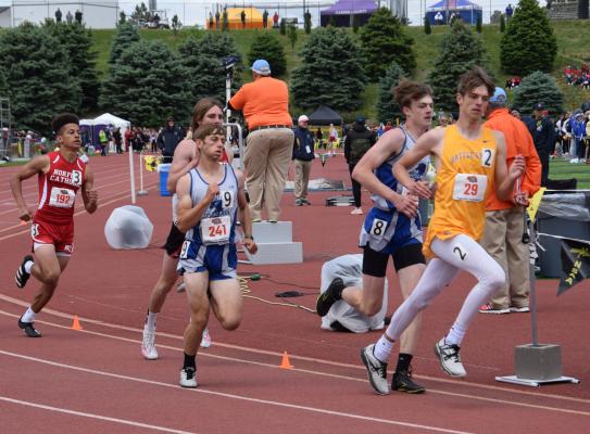 Silas Cool and Cache Gracey work to gain position on the curve in the 800 meters. (Courier photo by Loleta Connell)