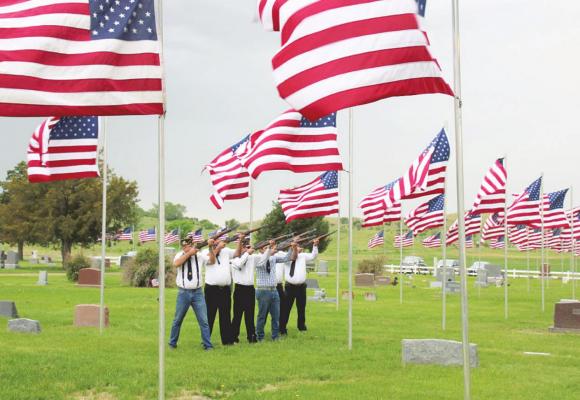 TOP LEFT: The Callaway American Legion Color Guard performs the 21-gun salute during the Memorial Day program at Rose Hill Cemetery on Monday.
