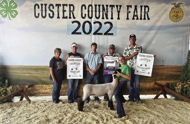 Abby Stallbaumer Champion Sr Showmanship and Elite Showmanship Sheep division winner. Champion 4-H Market lamb.