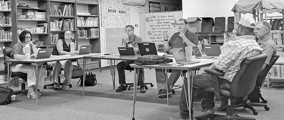 The Callaway school board voted to approve a policy prohibiting students from using cell phones and electronic communication devices during the school day. From left are Liana Hrupek, Rhonda Pandorf, Mike Reiff, Superintendent JD Furrow, Rebecca Eggleston (not showing), Jim Phelps, and TR Anderson. (Courier photo by Ellen Mortensen)