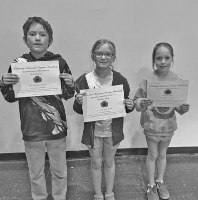 Second grade winners in the poster contest were, from left: Beau Duckett, third place; Brooklyn Bonde, second place; and Paityn Warren, first place. (Photos courtesy Mary Ann Boldt)