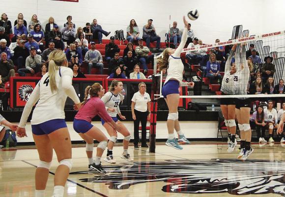 Abby Stallbaumer jumps for a kill against Twin Loup during the third set of the MNAC championship game on Saturday in Broken Bow. Courier photos by Amanda Wehnes