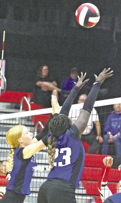 ABOVE: Gracie Brennan and Nyachay Haidle go up for a block in one of the games during the Anselmo-Merma triangular last week. LEFT: Josie Lehmkuhler gets in position to bump the ball. (Courier photos by Ronda McFate)