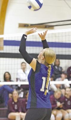 RIGHT: Rae Hagler positions herself to set the ball for the set during a match at the Seven Valleys Volleyball Tournament in Callaway on Saturday. (Courier photo by Ronda McFate)