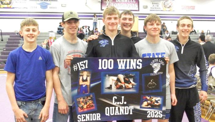 South Loup wrestler CJ Quandt earned his 100th career victory during the dual tournament at Burwell on Dec. 20. His teammates celebrated that accomplishment with him. (Courier photo by Brandy Mason)