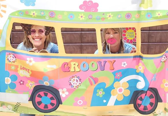 It was an evening filled with fun for back-to-school night at Callaway Public School on Aug. 14, for teachers and students alike. Here fourth grade teacher Nicole Rush, left, and Title 1 teacher Wendy Dockweiler hop on the “groovy” bus. (Photo courtesy CPS)