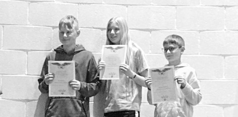6th grade Americanism essay winners, from left: 1st Remi Flynn, 2nd Gracie Brennan and 3rd Stetson Guthrie. Lynch.