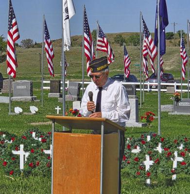 Dale Estergard, Commander of Callaway American Legion Post 59, welcomed guests to Rose Hill Cemetery on Monday morning for the annual Memorial Day tribute. (Photo courtesy Jo Chesley) THIS SPACE LEFT BLANK FOR MAILING LABEL
