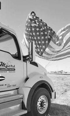 Myers Construction of Broken Bow provided a loaded dump truck to anchor the nearly 600-pound flag kite launched at this year’s Kite Flight.