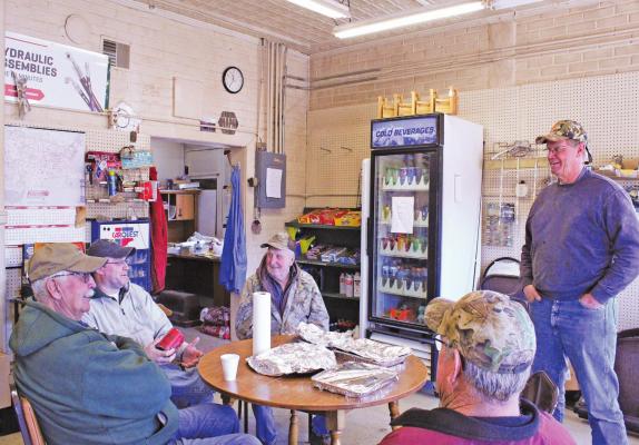 A group of guys has gathered at The Corner Stop for coffee and conversation for years. They will now have to find a new place to convene and solve the world’s problems. (Courier photo by Ellen Mortensen)
