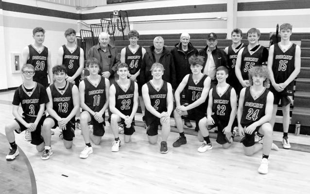 Four “ultimate Bobcat fans” were thanked by the South Loup boys’ basketball team for their support. The foursome is pictured with the team and are: back row, from left, Cal Joy, Denny Olson, Jerry Preston, and Darrel Johnson. (Courier photo by Loleta Connell)