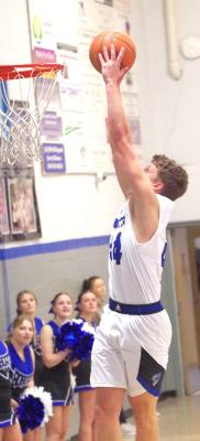 ABOVE LEFT: The Bobcats defense puts pressure on the Maxwell player during last week's game in Arnold. Shown are AJ Starr (#20) and Carter Wood (#15). ABOVE RIGHT: South Loup's Crew Witthuhn goes up for the basket in a game that saw him garner 19 points for the Bobcats on their way to victory. (Courier photos by Ronda McFate)