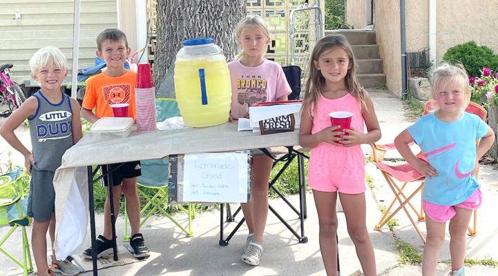 These children at Kayla Berg's daycare decided they wanted to help their community, so they set up a lemonade stand last week to help raise money for the new pool. From left are Kolt Berg, Hank Svoboda, Kaylee Berg, Kylee Berg, and Caroline Svoboda. Charlea Svoboda helped that afternoon but was napping when the photo was taken. (Photo courtesy Janet Kalinowski)