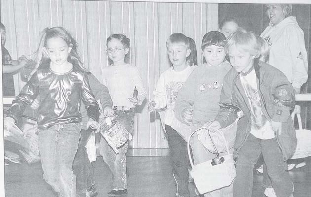 Dozens of chidren and their parents gathered at the Callaway Community Center to participate in the annual Callaway Chamber of Commerce Easter Candy Hunt. TirerOne Bank contributed quarters that were added to the brightly colored eggs stuffed with candy donated by Lynn Longmore and Larry Nelson. Pictured from left are: Aaron Smith, unidentified, Emily Kimball, unidentified, Stella Calvin, Noah Edgington, and sponsor Kristen Berg