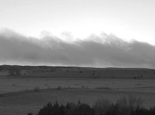 Though the black and white photo doesn't show it, the lighter shade just above the horizon is the glowing red from the Round Valley fire that broke out northeast of Broken Bow last Thursday. In total the fire burned 2,800 acres, and a Custer County man lost his life trying to protect his neighbors. This photo was taken from several miles away by Jeanne Farritor-Catlett.