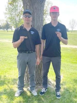 LEFT: Dawson Doggett, left, and Cache Gracey picked up individual medals at the district golf meet and qualified for the state meet.