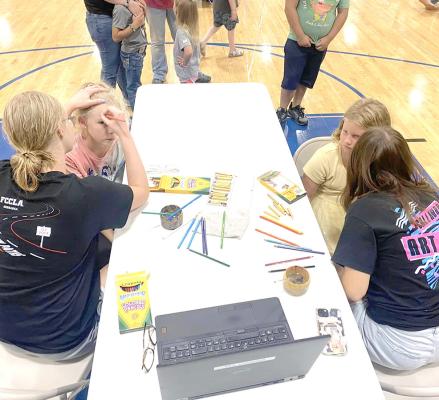 Members of the Callaway High School art club got in the spirit of fun during the back-to-school open hourse on Aug. 14, by offering face painting. It was a big hit with the younger students! (Photo courtesy CPS)