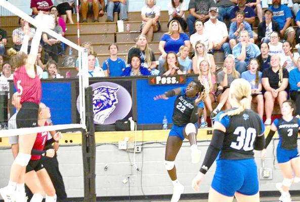 South Loup's Nyachay Haidle slams the ball over the net against Gothenburg on Sept. 12. We will have results of that game in next week's Courier. (Courier photos by Jessica Tickle)