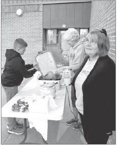 Reid Birkel, Sue Phelps, and Suzanne Wendorff (Teammate board member and Teammate mentor) prepare to serve the breakfast.