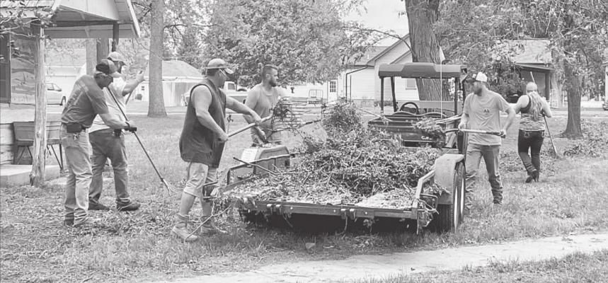 White and Skylar White work to clean up Morgan Park following th storm. (Photo courtesy Janel Brestel)