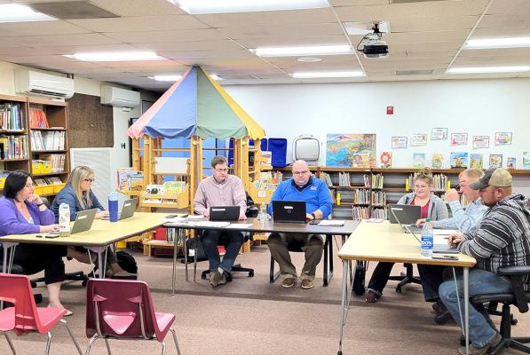 The Callaway school board engaged in a rather lenghty discussion concerning the hiring of a new ag and/or shop teacher for next year at their April 8 meeting. From left are Liana Hrupek, Rhonda Pandorf, Mike Reiff, Superintendent Bryon Hansen, Rebecca Eggleston, Jim Phelps, and TR Anderson. (Courier photo by Ellen Mortensen)