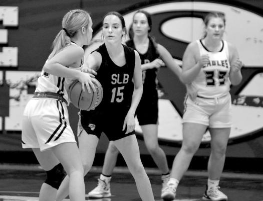 (Right) Twin sisters Kaygan and Kelynn Witthuhn play defense during Saturday's game vs. Southern Valley.