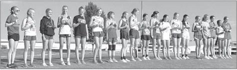 Ella Cool, fourth from left, finished 4th while teammate Ivy Tullils, 6th from right, finished in 14th place at the Ravenna cross country meet last week. (Courtesy photo)