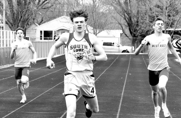 Cache Gracey finishes the 400m dash in 1st place at 52.18 in Burwell.