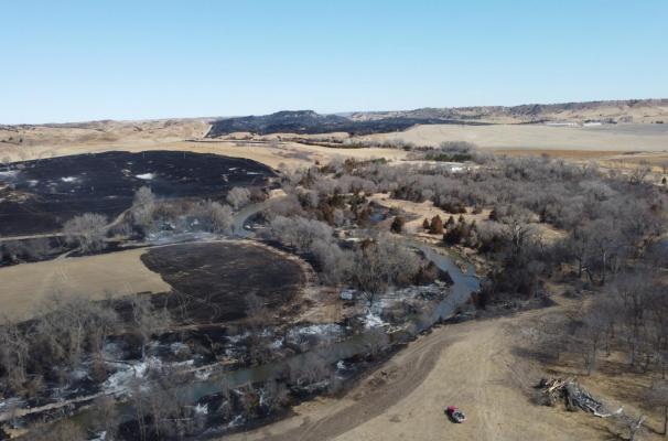 The March 24 fires burned along both sides of the river, but quick response by several area volunteer departments prevented the loss of any structures. (Photo courtesy Sandhills Express)