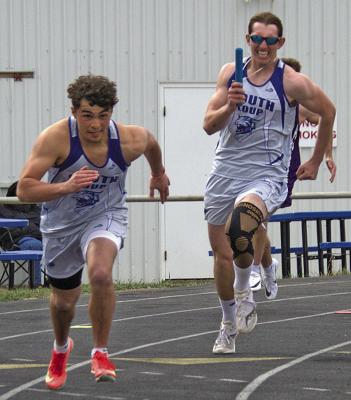 Conner Paulsen prepares to take the baton from Noah Anderson in the men’s 4x100 relay. (Courier photos by Ronda McFate)