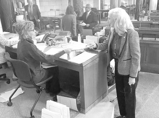 Pictured is Senator Storer submitting her first bill, LB61, which asks for an increased reimbursement rate for assisted living homes for memory care patients. (Photo courtesy Sen. Storer)