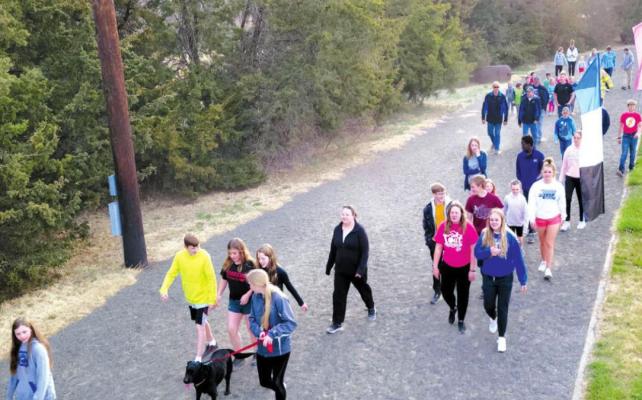 A large group gathered at the Callaway track on Wednesday morning, April 27, to raise funds for the local fire department. (Photo courtesy Sandhills Express)