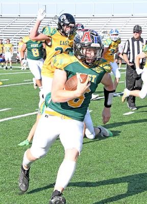 South Loup's Trey Connell scampers around the corner of the line and rushed in for an 11-yard touchdown during the fourth quarter of the 8-man All-Star game on June 15. The quarterback helped lead the West team to victory and earned Offensive MVP of the Game honors. (Courier photos by Loleta Connell)